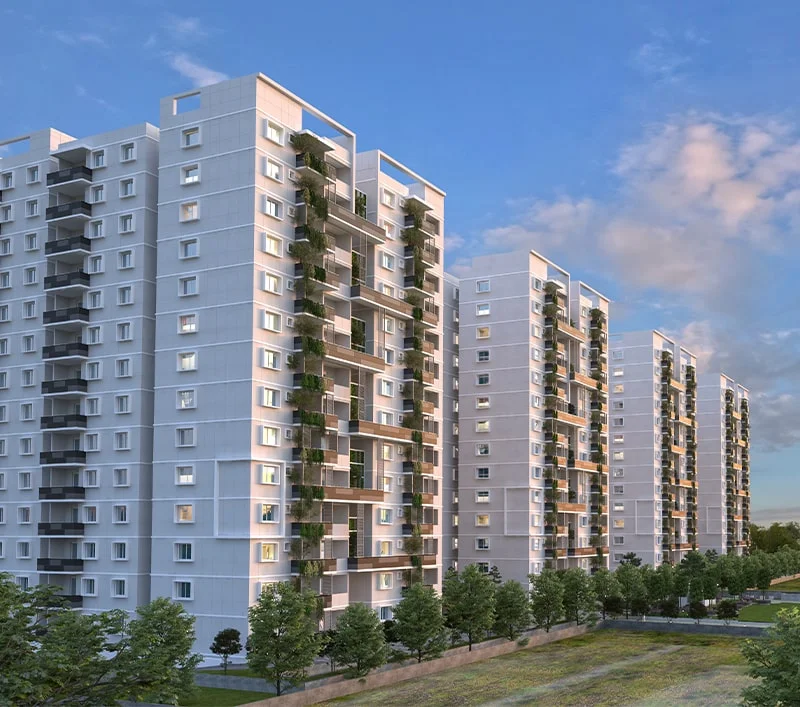 Exterior view of Mana Uber Verdant, a new launch project in Bangalore by Mana Projects, showcasing a row of high-rise apartment buildings with distinctive green-integrated architectural elements and serene surroundings.